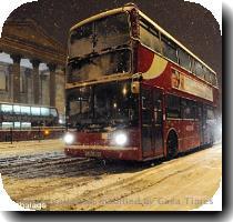 Britain suffered a second day of travel misery today as snow and ice continued to cause havoc on the roads  trains and at airports