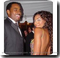 hotglued a lei to her dress but on her it worked  Both her hair and dress were simple  The flowered neckline framed her face instead of competing with it  Here is a picture of two of Roger Howarth s co stars on ATWT  Napiera Groves and Lamman Rucker  The pattern on her dress reminds me of a Pachinko machine  A very