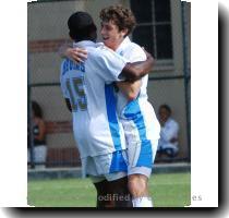 Freshman Dakota Collins celebrates his first goal with Amobi Okugo