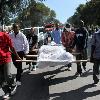 Men carry bodies for burial down a street in Port au Prince  Haiti  on Thursday  The earthquake s death toll is unknown  Men carry bodies for burial down a street in Port au Prince  Haiti  on Thursday  The earthquake s death toll is unknown