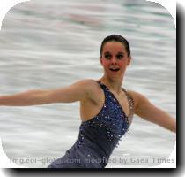 a triple flip double toeloop combination  a triple lutz and a double axel with a rousing presentation of  Carmen  by Georges Bizet  She was awarded 56 74 points and is in first place  Yukari Nakano from Japan finished second to Hughes on a score of 54 90 points  Skating to  Memoirs Of A Geisha  by John Williams  Nakano performed a graceful programme that included a Level