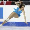 Emily Hughes of the U S  falls during her performance at the World Figure Skating Championships in Calgary March 22  2006   Reuters