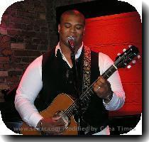 Susan Cagle pauses for a smile after a song  Michael Lynche performs