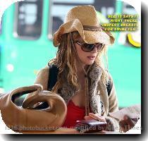 Heather Graham in a secret competition with Victoria Beckham for who can be the craziest dressed person inside an airport  These were snapped a couple days back as she departed from LAX  Photo Credit  Bauer Griffin Photo Credit  Bauer Griffin