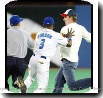 Police Constable Doug Carroll said the fan can pay a $49 dollar fine or fight it in court  AP TORONTO  AP     Toronto second baseman Orlando Hudson shoved a fan after the spectator ran