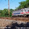 Click here to see a side view of Septa AEM 7  2305 with a Septa R 7 Regional Rail Trenton Line Train  The AEM7 is running north  east  and is just about to cross The Pennypack Creek Bridge