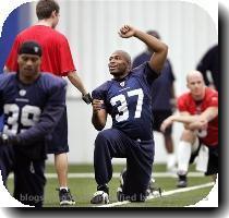 Seattle Seahawks quarterback Matt Hasselbeck  left  stretches next to defensive backs coach Teryl Austin  Seattle Seahawks running back Shaun Alexander  37  greets a team employee as he stretches