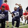 Seattle Seahawks quarterback Matt Hasselbeck  left  stretches next to defensive backs coach Teryl Austin  Seattle Seahawks running back Shaun Alexander  37  greets a team employee as he stretches