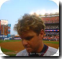 later  I saw a ball lying on the edge of the outfield grass  just beyond 3rd base  so I hurried over and asked Christian Guzman for it in Spanish and he tossed it to me  More disappointment