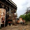 Why mention Bhopal  Because the New York Times had an article about it on July 9th  Slideshow here   Hundreds of tons of waste still languish inside a tin roofed warehouse in a corner of the old grounds of the Union Carbide pesticide factory here  nearly a quarter century after a poison