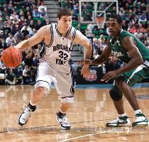 State s Raymer Morgan goes up for a dunk over BYU s Trent Plaisted and Chris Collinsworth  The Spartans beat BYU  68 61  Saturday at EnergySolutions Arena  Gallery  15 photos