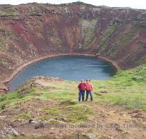 Speaking of volcanos   this one hasn t gone off for a while  There is quite some pool of water in the bowl though  That s my cousin on the left  Oh yes and there are water falls there  This one  next two pictures  is called Gullfoss or Golden Falls