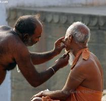 Barbers working along the river bank