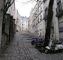 sidewalk  check  Narrow streets  hard to drive  not much parking  check  Buildings under 10 stories  adjacent to each other  check  Parks and plazas  but no  landscaping   check