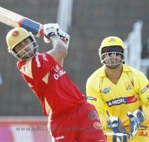 Royal Challengers Bangalore s Virat Kohli plays a shot as Chennai Super Kings  MS Dhoni looks on  during their IPL match in Durban on Thursday   AP Photo