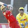 Royal Challengers Bangalore s Virat Kohli plays a shot as Chennai Super Kings  MS Dhoni looks on  during their IPL match in Durban on Thursday   AP Photo