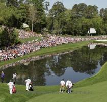 <p>From left  Fred Couples  Jim Furyk and Tiger Woods skip their balls across a water on the 16th hole during a practice round for the Masters golf tournament in Augusta  Ga   Monday  April 5  2010  The tournament begins Thursday  April  8  < p>