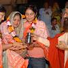 Pujya Swamiji blesses Smt  Varshaben Patel and her divine daughters Poorna and Niyati