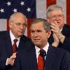 President George W  Bush is applauded by Vice President Dick Cheney  L  and the joyful House Speaker Dennis Hastert  joint session of Congress  Washington February 27  2001  Doug Mills