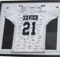 21 on Display Amari Spievey s football jersey  signed by the players and coaches of the 2005 State Championship Football team is now hanging proudly in the Arthur M  Kohs Gymnasium along with Xavier s