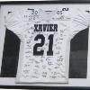 21 on Display Amari Spievey s football jersey  signed by the players and coaches of the 2005 State Championship Football team is now hanging proudly in the Arthur M  Kohs Gymnasium along with Xavier s