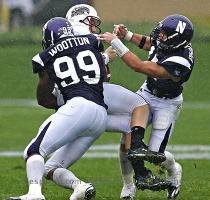 Jerry Lai US Presswire Sep 13  2008  Evanston  IL  USA  Southern Illinois Salukis quarterback Chris Dieker  center  is sacked by Northwestern Wildcats defensive end Corey Wootton  99