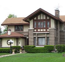 Designer unknown  1910 An intriguing combination of Prairie and Tudor  sadly and badly modified by the enclosure of the front porch