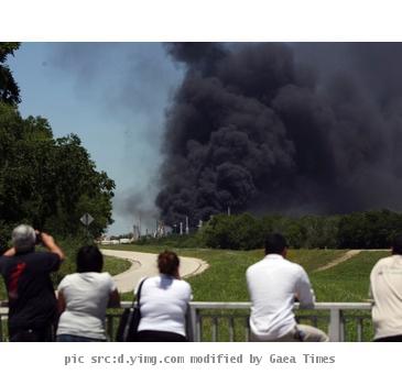 <p>People watch the AGE refinery fire Wednesday May 5  2010 in San Antonio from a bridge south of the fire  An 18 wheeler being loaded with fuel at a San Antonio refinery exploded Wednesday  setting off a chain reaction of smaller explosions and sending a towering plume of thick black smoke over the city s southeast side  One person was critically burned  and the driver of the exploding truck remained missing   AP Photo San Antonio Express News  John Davenport  MAGS OUT  TV OUT  NO SALES  SAN ANTONIO OUT  MANDATORY CREDIT< p>