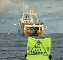 Targeting the bottom trawlers  destruction on the high seas A Greenpeace activist protests against the EU deep sea bottom trawler Playa de Menduina  fishing in the North Atlantic  Greenpeace is protesting against the destruction caused by this fishing