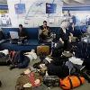 <p>JetBlue Airways Corp  passengers sleep and work on computers as they wait for flights at New York s John F  Kennedy Airport  in this Feb  15  2007 file photo  Travel in 2007 was marked by high gas prices  new passport rules  record lows for the dollar  and record high air travel  < p>