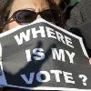 An Iranian woman in Paris protests on Saturday against presidential election results in her country  as its leader warned of a crackdown on rallies  AP