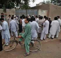 <p>Residents and media gather outside the ancestral home of the family of Faisal Shahzad  a Pakistani American held in New York on suspicion of driving a bomb laden car into Times Square  in the village of Mohib Banda  near the main northwestern city of Peshawar  May 5  2010  < p>