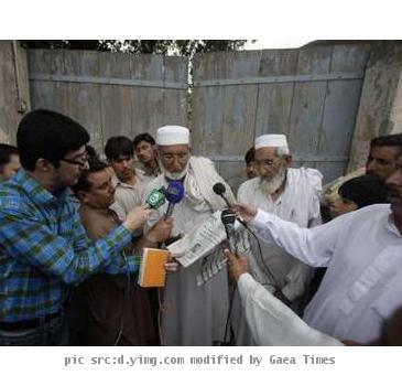 <p>Nazirullah  a resident  shows the media a newspaper that had published a picture of Faisal Shahzad  a Pakistani American held in New York on suspicion of driving a bomb laden car into Times Square  outside the ancestral home of Shahzad  family in Mohib Banda  in Pakistan  north western Khyber Pakhtoonkhwa province  May 5  2010  Shahzad has admitted to trying to detonate the bomb in a sports utility vehicle and receiving explosives making training in a known Taliban and al Qaeda stronghold in Pakistan  U S prosecutors say  REUTERS Faisal Mahmood < p>