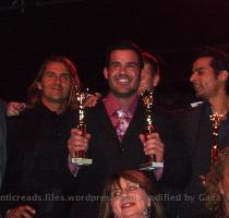 Charles Paz with both his trophies  which were presented by Mr  Romance 2008 Chris Winters