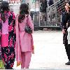 each other and having fun  Girls are wearing shalwar kameez of lovely prints and are busy in shopping  Girls love to buy handmade shawls and other handicraft  sell in the shops of mall road