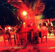 Hamaca Beach Resort  This outdoor bar is on the sand with palm hut style canopies over tables mounted to the canopy trunks  This bar is mostly popular with tourist and Dominican couples