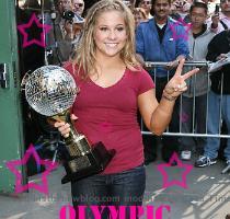 Dancing with the Stars champ   beating out the much beloved actor Gilles Marini   Here is a pic of Shawn at Good Morning America earlier this morning showing off her sparkly new trophy  Shawn Johnson is adding a mirrorball trophy to her collection of Olympic medals  After all  the two glittering prizes seem to go very well together  The 17 year old gymnast was named  Dancing