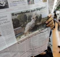 AP Photo 12 months ago South Korean subway passengers read newspapers reporting the demolition of North Korea s nuclear