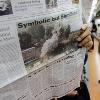 AP Photo 12 months ago South Korean subway passengers read newspapers reporting the demolition of North Korea s nuclear