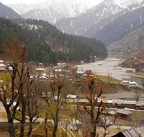 lies across the river and is connected with the Neelum Road by a beautiful long wooden suspended bridge  The town has a small shopping market which offers local handicrafts and households  A View of Sharda Town Towards the heightened portion of the town on the adjacent hill  there lie some ruins of an ancient Buddhist University and The Sharda Temple   The area is under control