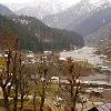 lies across the river and is connected with the Neelum Road by a beautiful long wooden suspended bridge  The town has a small shopping market which offers local handicrafts and households  A View of Sharda Town Towards the heightened portion of the town on the adjacent hill  there lie some ruins of an ancient Buddhist University and The Sharda Temple   The area is under control