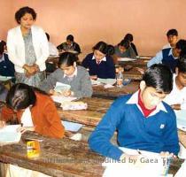 Students appearing in the High School Leaving Certificate Examination  HSLC  under SEBA in a city school on Friday    AT photo   Prev