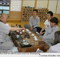 Visitors thread 108 beads while doing the 108 prostrations By Jang Eun hwaContributing writerFollowing a refreshing breeze of early autumn  we started for a temple about 200 kilometers east of Seoul  Our destination was Samhwa Temple  a branch temple for the Jogye Order s fourth District  in Donghae  Gangwon Province Today s team for an overnight temple stay is composed of five  a French researcher in her late 20s  and the rest in their late 40s or early 50s comprising a lawyer  a company executive  a publisher  and a freelance writer  Although we shared one thing in common   namely  the trip   we were as much strangers to one another as our respective jobs  Nevertheless  we felt affinity for each other from the outset  What made the five strangers feel familiar to each other The ``middle age   to which the older four members belong is generally called ``chilgong palgong  70s and 80s  generation   in Korea  They spent their university days under a dictatorship regime  and often took part in student activism longing for establishing justice and democracy in the country  The social atmosphere of those days was generally gloomy  oppressed  and frustrated  while being frequently thrown into turmoil  which contributed to forming a resistant  critical counterculture of their own  The more fundamental reason for the willingness to join together  however  is perhaps the sense of emptiness arising from inside  I don t know whether the others will agree with me or not  but it is apparent that we  city dwellers  almost always aspire for a calm retreat to escape from our routine  secular affairs Samhwa Temple and Mt  DutaSamhwa Temple is located on the lower part of Mt  Duta  one of the most beautiful  scenic mountains in Korea  Here  the name  Duta  comes from the Sanskrit  ``dhuta    or the ascetic practice forsaking the attachment for food  clothing  and shelter  Or alternatively it simply represents a dhuta practicing monk  From Buddha s time  there have been 12 categories of strict dhuta practices  some of which are as 