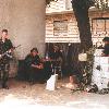 British Volunteer  holding AK 47  and three Bosnian Croatian members of the unit at the base  The base was located at the old school house in Sijekovac on the