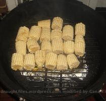 Take each piece of corn and dip it into the olive oil  then place on grill