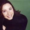 TBH she doesn t look too bad when she s not playing the part  she has some stand up comedy you can see on youtube  her actual name s Stephanie Courtney