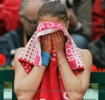 Russia s Dinara Safina reacts after being defeated by compatriot Svetlana Kuznetsova during the women s singles final of the French Open tennis tournament at the Roland Garros stadium