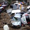 of flooding  landslides     are increasing both in frequency and severity   burying building  cars  humans and everything else in their paths  Bury the cars  before the cars bury YOU  Flooding in Busan  South Korea  July 16  2009  Photo  AFP  Image may be subject to copyright  Torrential rains caused flooding in South Korea triggering landslides  which buried at least a