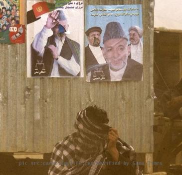 Next   Reuters Pictures 4 weeks ago An Afghan man covers his face as he squats in front of election posters of Afghan President