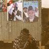 Next   Reuters Pictures 4 weeks ago An Afghan man covers his face as he squats in front of election posters of Afghan President